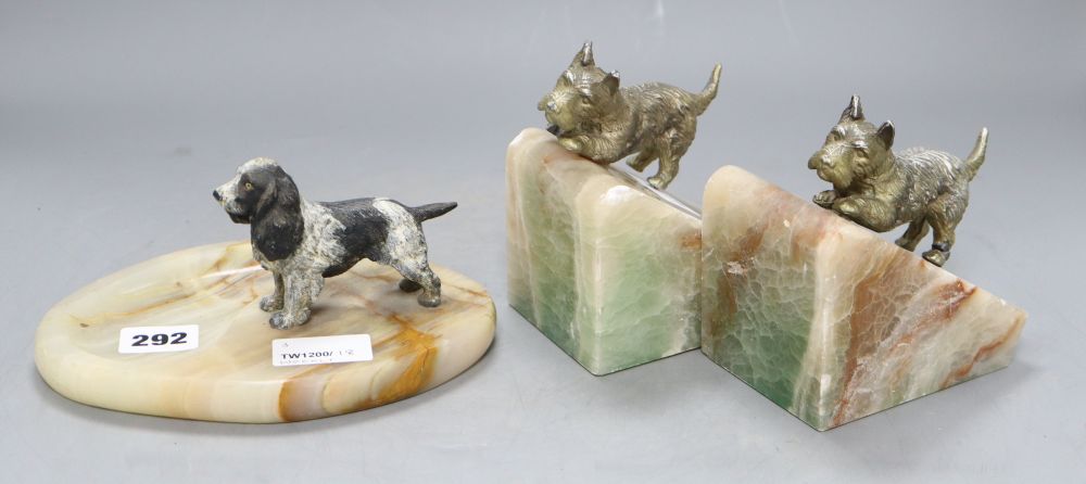 A cold cast bronze model of a spaniel on onyx ashtray, height 9cm and a pair of Scottish Terrier bookends (damage)